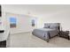 Bedroom with gray-scale interior design, carpeted floor, and natural light at 6261 Lamont Hills Ave, Las Vegas, NV 89139