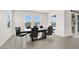 Dining room boasts a modern table, comfortable seating and bright natural light at 6261 Lamont Hills Ave, Las Vegas, NV 89139