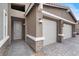 Attractive single-story home with a three-car garage and stone veneer accents at 6261 Lamont Hills Ave, Las Vegas, NV 89139