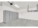 Clean garage with storage cabinets and overhead storage for a clutter-free space at 6261 Lamont Hills Ave, Las Vegas, NV 89139