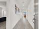 Bright hallway features stylish wood floors and modern recessed lighting at 6261 Lamont Hills Ave, Las Vegas, NV 89139