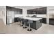 Spacious kitchen features an island with bar seating, stainless steel appliances, and ample cabinet space at 6261 Lamont Hills Ave, Las Vegas, NV 89139
