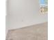 Bright living room with wall-to-wall carpeting and two large windows at 6261 Lamont Hills Ave, Las Vegas, NV 89139