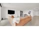 Cozy living room featuring a large sectional sofa and a wet bar at 6261 Lamont Hills Ave, Las Vegas, NV 89139