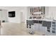 Modern wet bar featuring wine storage, a countertop, and bar seating at 6261 Lamont Hills Ave, Las Vegas, NV 89139