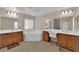 Spacious bathroom featuring a soaking tub, double sinks, and plenty of counter space at 6647 Rego Park Ct, Las Vegas, NV 89166