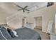 Upstairs bedroom with stairs, ceiling fan, lots of room and neutral paint at 6647 Rego Park Ct, Las Vegas, NV 89166