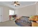 Bedroom with a desk, ceiling fan, and vibrant lighting at 6647 Rego Park Ct, Las Vegas, NV 89166
