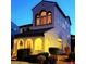 Inviting exterior displaying arched doorway, well-placed windows, and manicured bushes at 6647 Rego Park Ct, Las Vegas, NV 89166