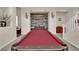 Open game room with a pool table and a decorative wooden wall at 6647 Rego Park Ct, Las Vegas, NV 89166