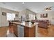 Well-lit kitchen with granite counters, and stainless steel dishwasher at 6647 Rego Park Ct, Las Vegas, NV 89166