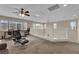 The loft features neutral colored carpet, ceiling fan and lots of natural light at 6647 Rego Park Ct, Las Vegas, NV 89166