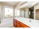 Bathroom with double sink vanity, a bathtub, and a separate glass-enclosed shower at 6856 Council Heights Way, Las Vegas, NV 89142