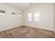 Spacious bedroom with carpet flooring and natural light from multiple windows at 6856 Council Heights Way, Las Vegas, NV 89142