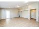 Open-concept living room, featuring neutral walls, tile flooring, and natural light at 6856 Council Heights Way, Las Vegas, NV 89142