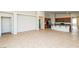 Bright and open living room featuring tile floors and an easy flow into the kitchen at 6856 Council Heights Way, Las Vegas, NV 89142