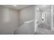 Upstairs hallway with carpet and laundry hookups in closet at 687 Porchtown Ave, Las Vegas, NV 89183