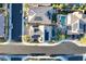 An aerial view of the home and neighborhood featuring solar panels, landscaping, swimming pools, and neighborhood streets at 8136 Canyon Grassland St, Las Vegas, NV 89166