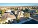 Beautiful aerial view of a residential neighborhood featuring well-maintained homes, lush landscaping, and desert scenery at 8136 Canyon Grassland St, Las Vegas, NV 89166