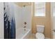Full bathroom with a tub, shower, toilet, and window at 8136 Canyon Grassland St, Las Vegas, NV 89166