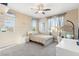 Bright bedroom with decorative hanging chair and ample natural light at 8136 Canyon Grassland St, Las Vegas, NV 89166