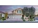 Charming two-story home featuring a three-car garage, manicured landscaping, and a welcoming entrance at 8136 Canyon Grassland St, Las Vegas, NV 89166