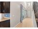 Hallway featuring light tile floors, natural light, and stairs at 8136 Canyon Grassland St, Las Vegas, NV 89166
