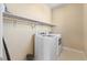 Laundry room featuring a side-by-side washer and dryer set and a long shelf above at 8136 Canyon Grassland St, Las Vegas, NV 89166