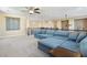 Upstairs living room with comfortable blue sofa and large open space at 8136 Canyon Grassland St, Las Vegas, NV 89166