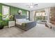 Bright bedroom with accent wall, plush carpet, and sliding door access to the backyard at 8136 Canyon Grassland St, Las Vegas, NV 89166