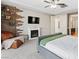 Carpeted bedroom features a fireplace and decorative wood accent wall at 8136 Canyon Grassland St, Las Vegas, NV 89166