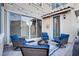 Inviting outdoor patio featuring comfortable seating around a fire pit, framed by string lights and modern design elements at 8136 Canyon Grassland St, Las Vegas, NV 89166
