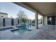 Spacious covered patio with pool, spa and luxurious outdoor seating, perfect for entertaining or relaxing at 8136 Canyon Grassland St, Las Vegas, NV 89166