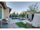 Inviting backyard pool and spa with poolside seating, outdoor grill, and lush landscaping at 8136 Canyon Grassland St, Las Vegas, NV 89166