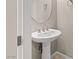 Powder room featuring pedestal sink and neutral paint at 8136 Canyon Grassland St, Las Vegas, NV 89166