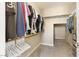 Spacious walk-in closet with ample hanging space and shelving at 8136 Canyon Grassland St, Las Vegas, NV 89166