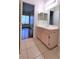 Well-lit bathroom featuring a light wood vanity, a neutral color scheme, and a view into the next room at 9000 Las Vegas Blvd # 1074, Las Vegas, NV 89123