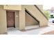Beige stucco exterior with a brown door and the unit number, with stairs leading to a second level at 9000 Las Vegas Blvd # 1074, Las Vegas, NV 89123