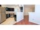 Kitchen boasts stainless steel appliances, black cabinets, and stone countertops, open to the living area at 9000 Las Vegas Blvd # 1074, Las Vegas, NV 89123