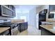 Well-equipped kitchen featuring modern appliances, tile flooring, and granite countertops at 9000 Las Vegas Blvd # 1074, Las Vegas, NV 89123