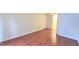 Bright living room featuring hardwood floors, a white door, and neutral walls at 9000 Las Vegas Blvd # 1074, Las Vegas, NV 89123