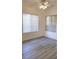 Light-filled bedroom showcasing neutral walls, laminate flooring, and natural light from two windows at 9000 Las Vegas Blvd # 1133, Las Vegas, NV 89123