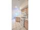 Well-lit kitchen with white appliances, tile flooring, and a view into the dining area at 9000 Las Vegas Blvd # 1133, Las Vegas, NV 89123