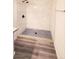 Modern shower featuring blue mosaic tile floor, sleek marble tile surround, and black hardware at 9000 Las Vegas Blvd # 1133, Las Vegas, NV 89123