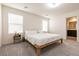 Bright bedroom featuring a minimalist design with a wooden bed frame at 9526 Granville Bridge St, Las Vegas, NV 89139