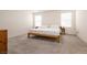 Comfortable bedroom featuring a king bed and ample natural light from two windows at 9526 Granville Bridge St, Las Vegas, NV 89139