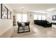 Open-concept dining and living area features stylish table, chairs, decor, and a comfortable sofa at 9526 Granville Bridge St, Las Vegas, NV 89139