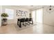 Bright dining room boasts modern table, decor, neutral walls and tile floor, creating inviting atmosphere at 9526 Granville Bridge St, Las Vegas, NV 89139