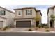 Charming two-story home featuring a tile roof, a two-car garage, and well-maintained landscaping at 9526 Granville Bridge St, Las Vegas, NV 89139