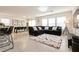 Open-concept living room featuring a large sectional sofa and plenty of natural light at 9526 Granville Bridge St, Las Vegas, NV 89139